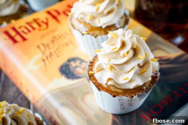 An array of Harry Potter Butterbeer Cupcakes, ready to be enjoyed, with their rich toppings and thematic decorations.