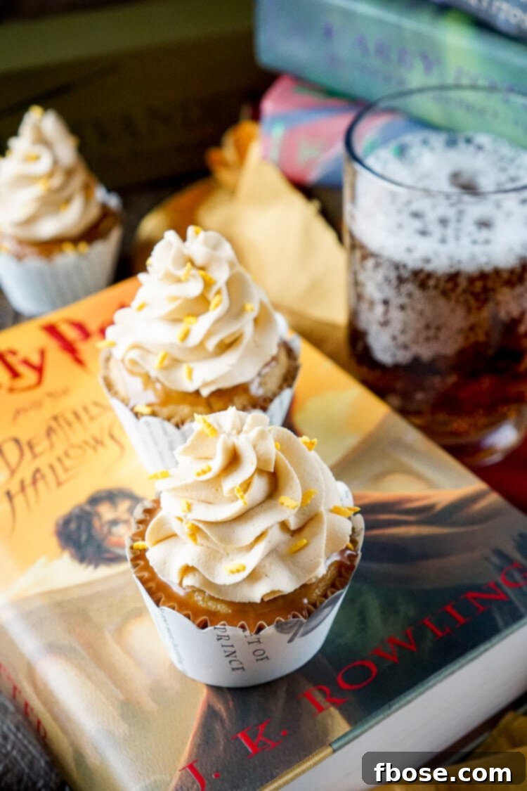 Overhead shot of Harry Potter Butterbeer Cupcakes, beautifully arranged with sprinkles and rich frosting, inviting a magical taste.