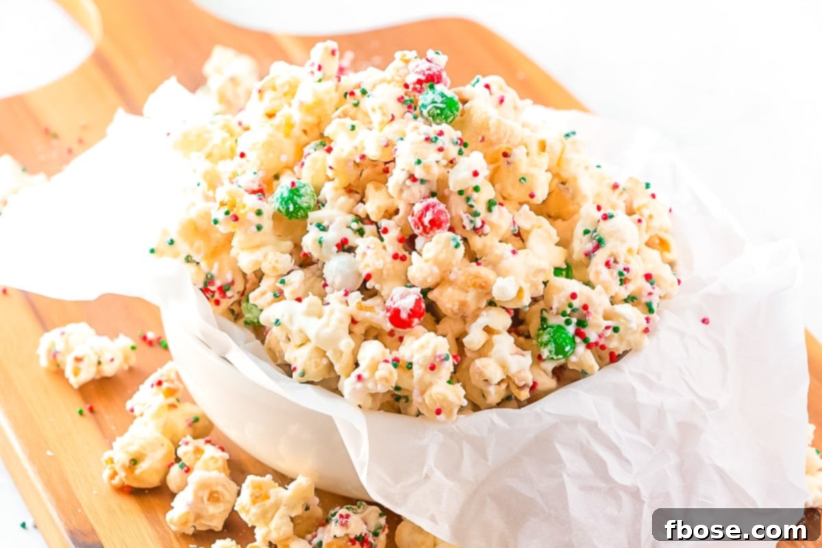 Close up photo of finished Christmas popcorn in a white serving dish, ready for enjoyment.