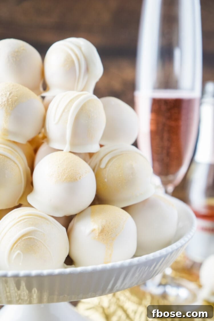 Indulge in these glamorous Strawberries & Champagne Cake Balls, perfect for festive gatherings like New Year's Eve, Valentine's Day, and bridal showers. A sweet, easy-to-make dessert with a hint of bubbly elegance.