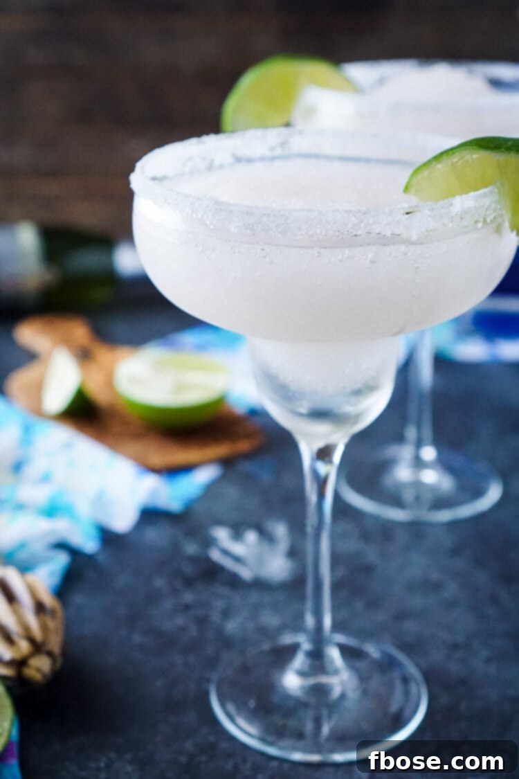 These Frozen Champagne Margaritas are a fun blend of silver tequila, bubbly champagne, limes, and ice! They're perfect for New Year's Eve, Cinco de Mayo, or any occasion where you just want a cocktail that's refreshing and delicious! 