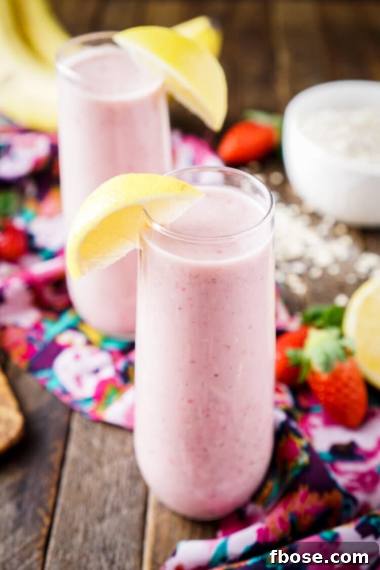 Zesty Berry Banana Bliss 4 Close-up of the smooth, vibrant texture of a Strawberry Banana Lemon Smoothie, indicating its freshness