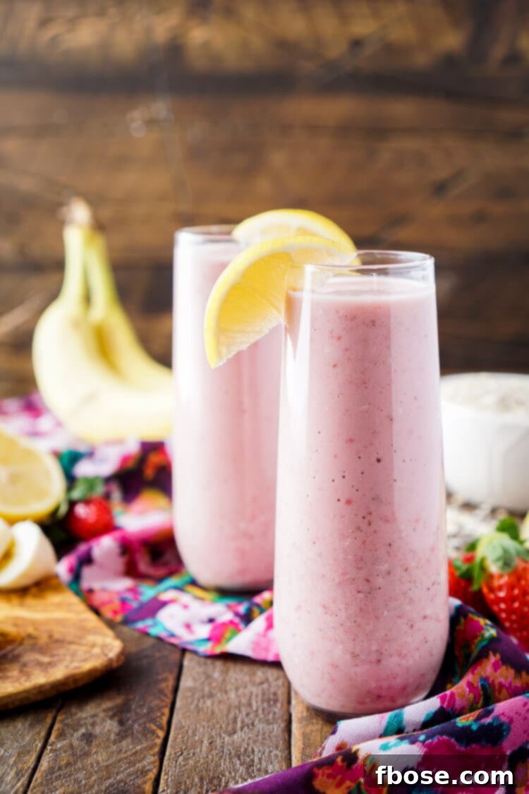 Zesty Berry Banana Bliss 7 A final close-up of the delicious and healthy Strawberry Banana Lemon Smoothie, garnished with a fresh strawberry slice
