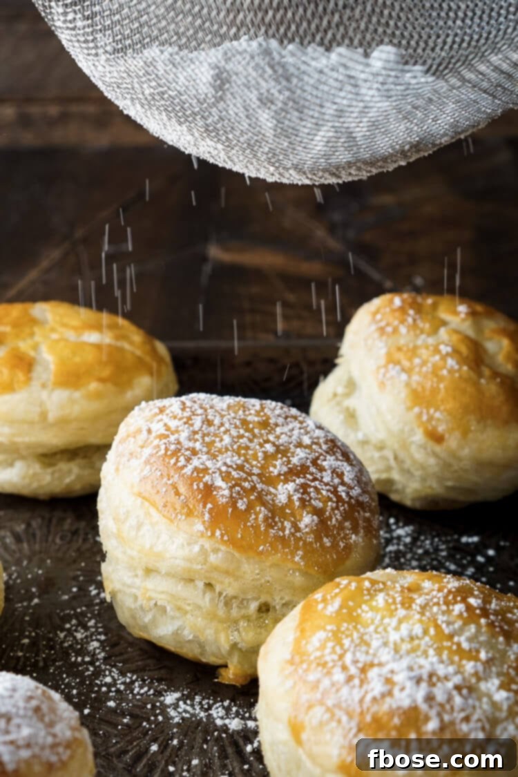 A plate of freshly baked Croissookies, golden and slightly puffed, waiting to be garnished.