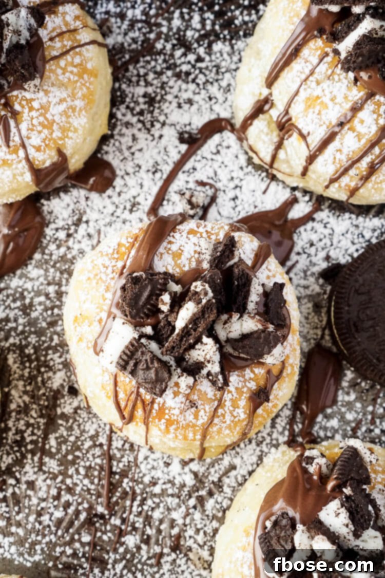 Three Croissookies presented on a rustic wooden board, showing off their crispy, golden pastry.