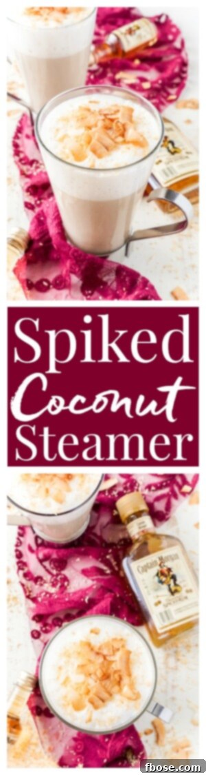 This Spiked Coconut Vanilla Steamer is one of the coziest winter cocktails you'll ever have! Made with real vanilla beans, coconut, milk, and spiced rum! It's delicious and frothy and topped with toasted coconut!