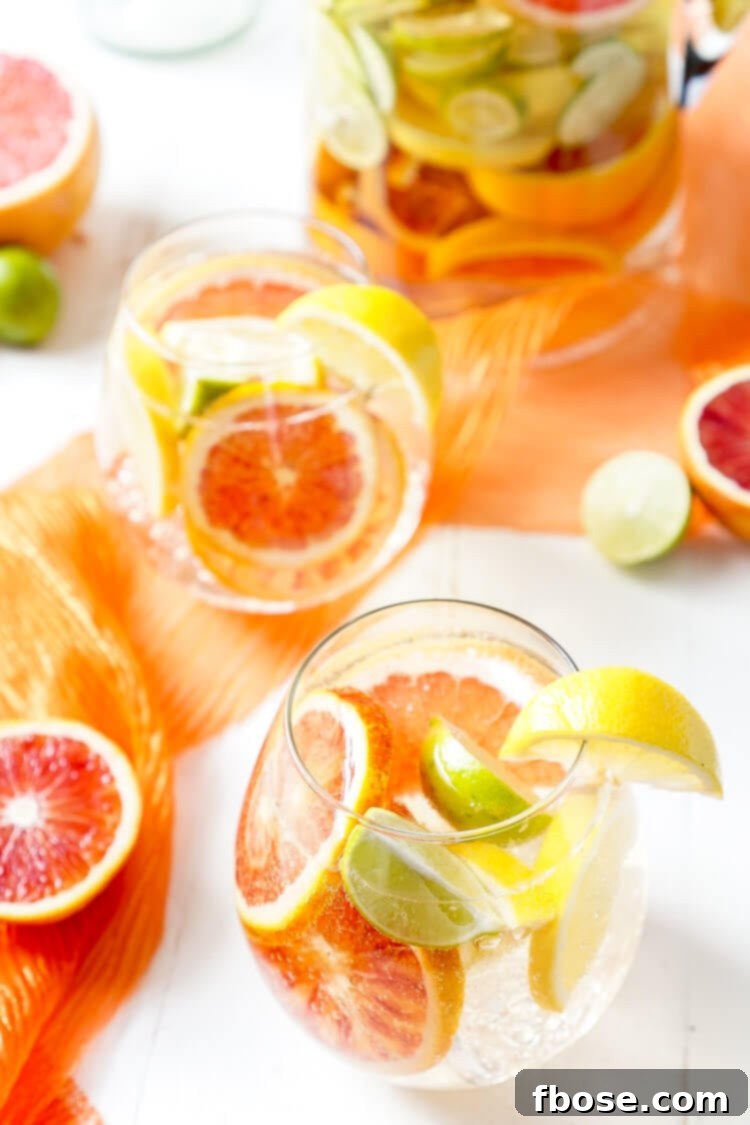 Glasses of refreshing Citrus Sangria ready to be served, garnished with colorful fruit slices.