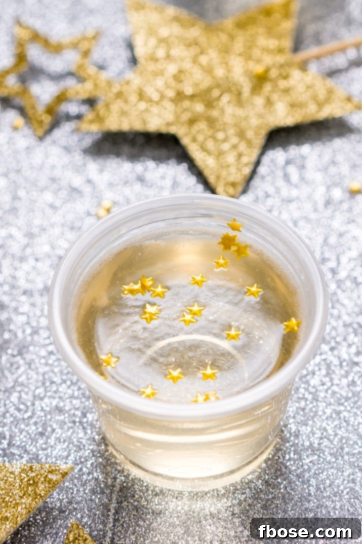 These Champagne Jello Shots are made with champagne, ginger ale, lemon juice, sugar, and gelatin and are so easy to whip up for your New Year's Eve and other celebrations!