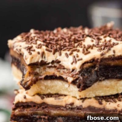 Billionaire bars stacked on top of each other with a bite missing from the top one.