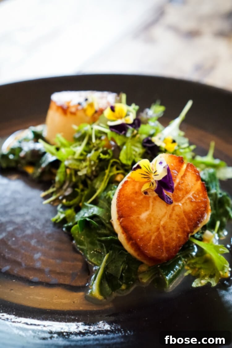 Exquisitely plated gourmet meal with fresh vegetables at The Grill