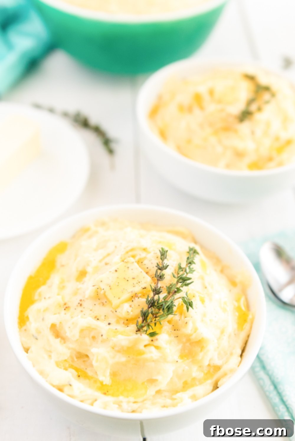Bowl of Mashed Potatoes made with Yukon Gold, garlic, cream, butter, and thyme