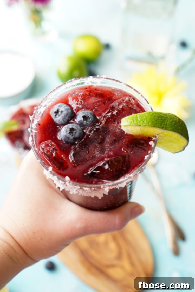 Experience the ultimate summer refreshment with this Fresh Blueberry Margarita, featuring ripe blueberries and Altos Tequila, a quintessential New England cocktail.