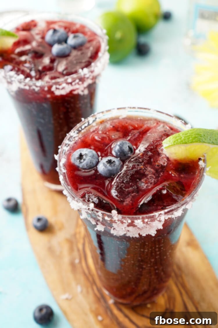 Savor the taste of summer with this exquisite Fresh Blueberry Margarita, an artful blend of ripe blueberries and Altos Tequila, delivering a refreshing New England character.