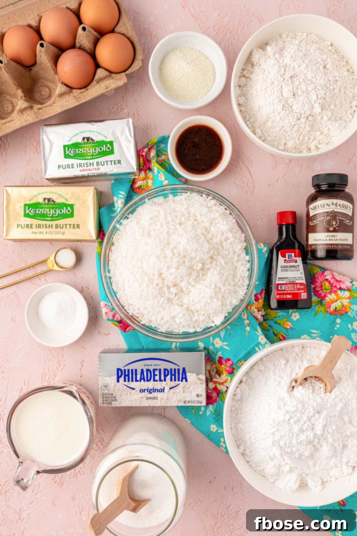 An overhead shot showcasing all the fresh, high-quality ingredients laid out on a table, ready to be transformed into a delicious coconut cake.