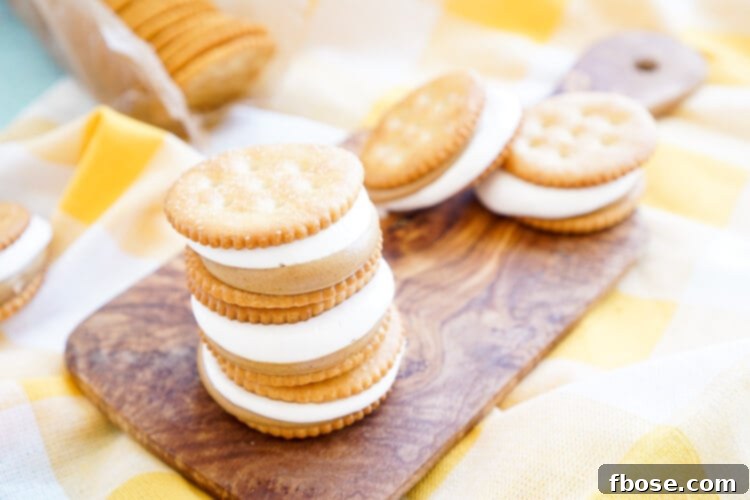 Close-up of Fluffernutter RITZwiches, showcasing the creamy peanut butter and fluffy marshmallow filling between two golden RITZ crackers. An ideal quick snack for children and adults alike.