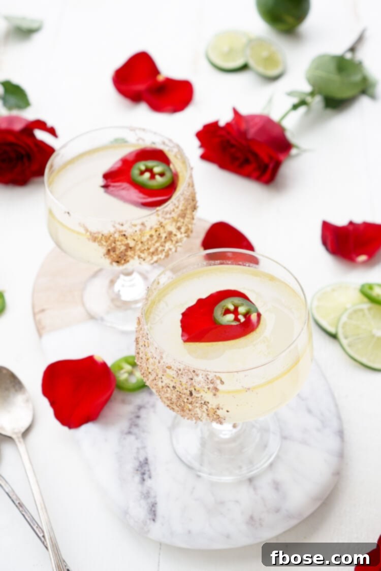 A stunning Patrón Margarita of the Year cocktail, known as Rosa Picante, presented elegantly.
