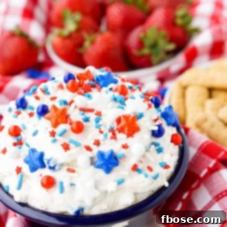 Red, White & Blue Cake Batter Dip garnished with festive sprinkles.