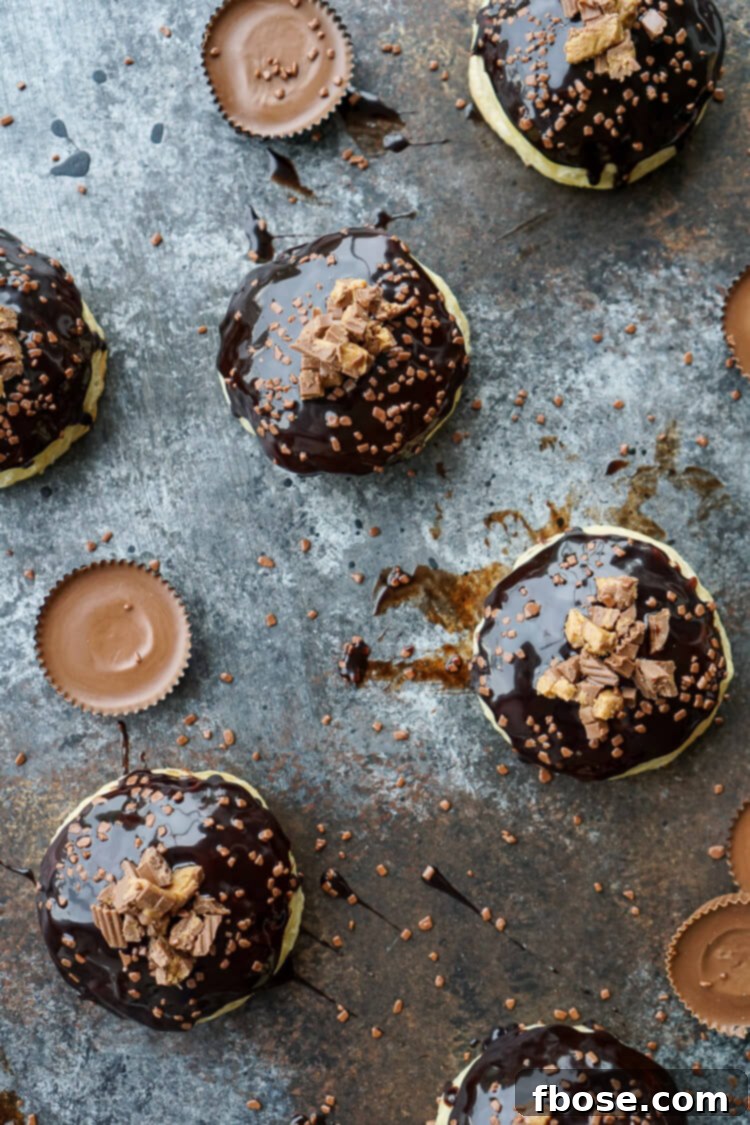 Reese's Stuffed Puff Pastry Donuts stacked on a serving platter