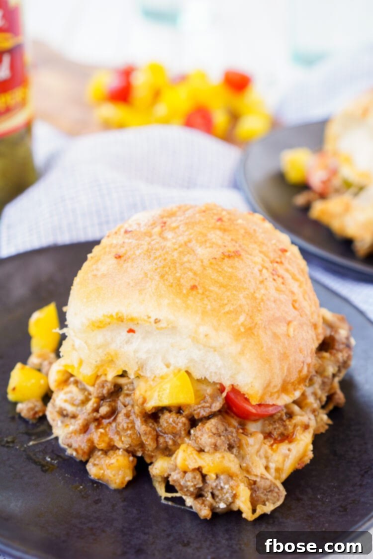Irresistible Easy Taco Sliders, baked to golden perfection with melted cheese and savory taco meat, perfect for parties and quick dinners.