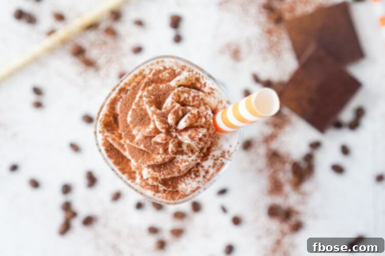 Two glasses of Mocha Coffee Punch on a rustic table, perfect for summer entertaining