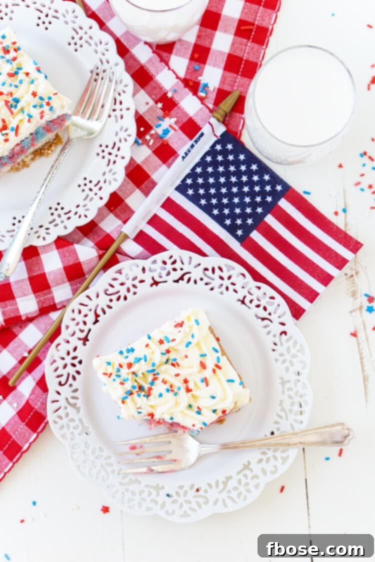 Americana Swirl Sheet Cake 7 This Red, White, and Blue Marble Sheet Cake is made with an adapted cake box mix and topped with a whipped white chocolate frosting. It's the perfect patriotic dessert for the 4th of July!