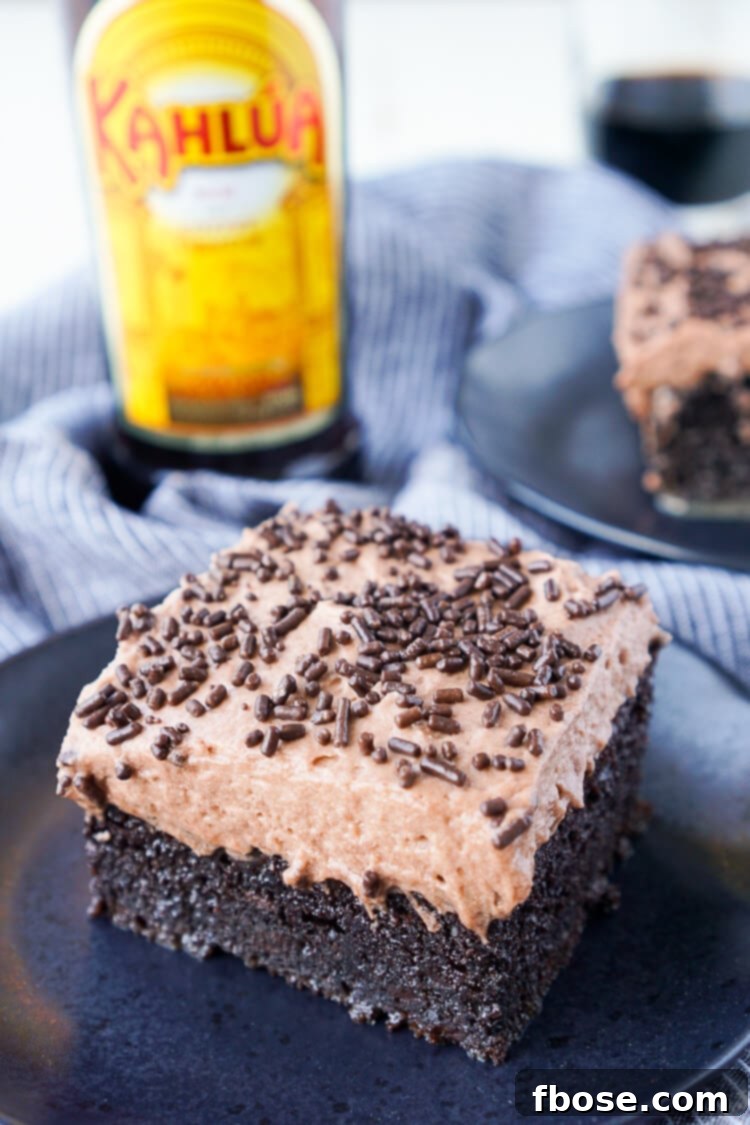 This Kahlua Chocolate Poke Cake is a deliciously boozy dessert that will get any party started! This Chocolate cake is baked with, soaked in, and frosted with Kahlua. It's the ultimate boozy dessert!