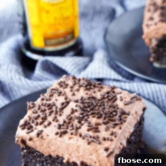 This Kahlua Chocolate Poke Cake is a deliciously boozy dessert that will get any party started! This Chocolate cake is baked with, soaked in, and frosted with Kahlua. It's the ultimate boozy dessert!