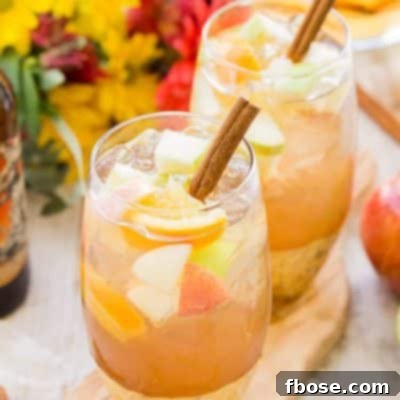 This Hard Apple Cider Sangria brings together the cozy flavors of fall in a crisp and refreshing batch cocktail!