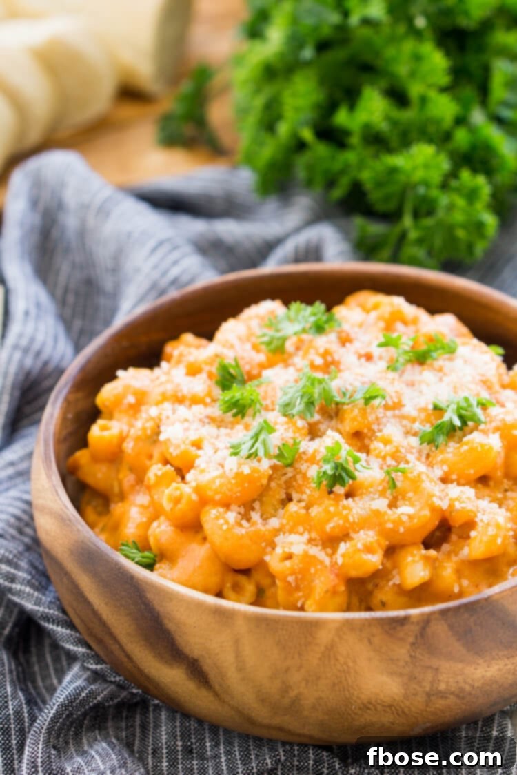 Close-up of Marinara Mac and Cheese with a blend of melted cheeses and tomato sauce.