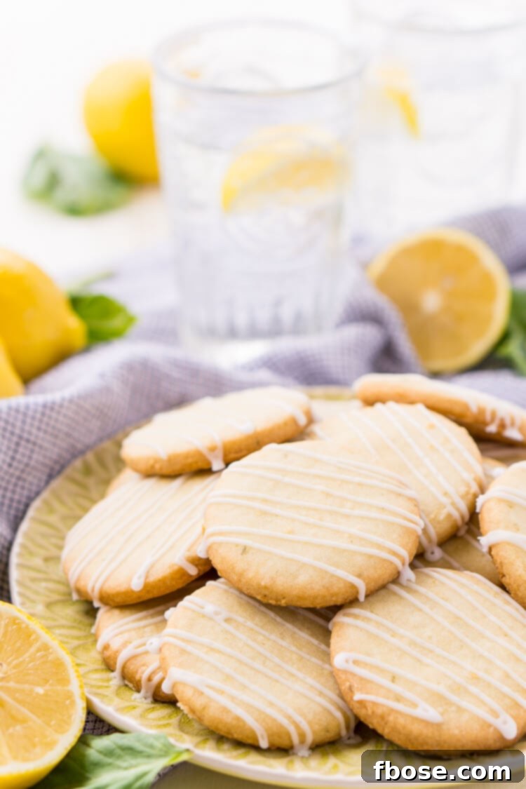 These Lemon Basil Shortbread Cookies will melt in your mouth, they're rich, sweet, and flaky. Made with butter, confectioners' sugar, flour, lemon zest, basil, and salt, they're perfect for tea, parties, or snacking!