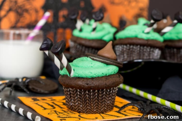 A row of Melted Witch Cupcakes on a cooling rack, ready for decoration.