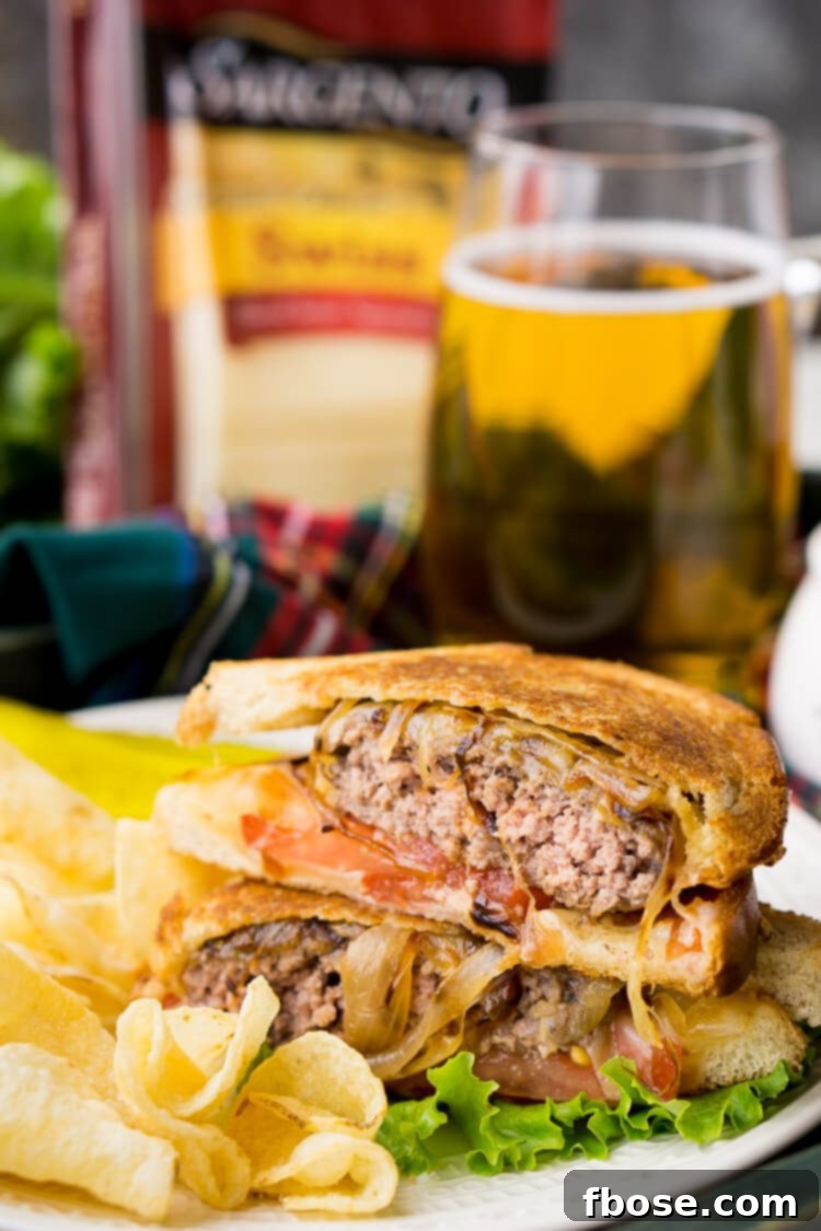The Ultimate Patty Melt 4 A stack of ingredients for a Patty Melt: sliced onions, ground beef patties, Swiss cheese, and bread.
