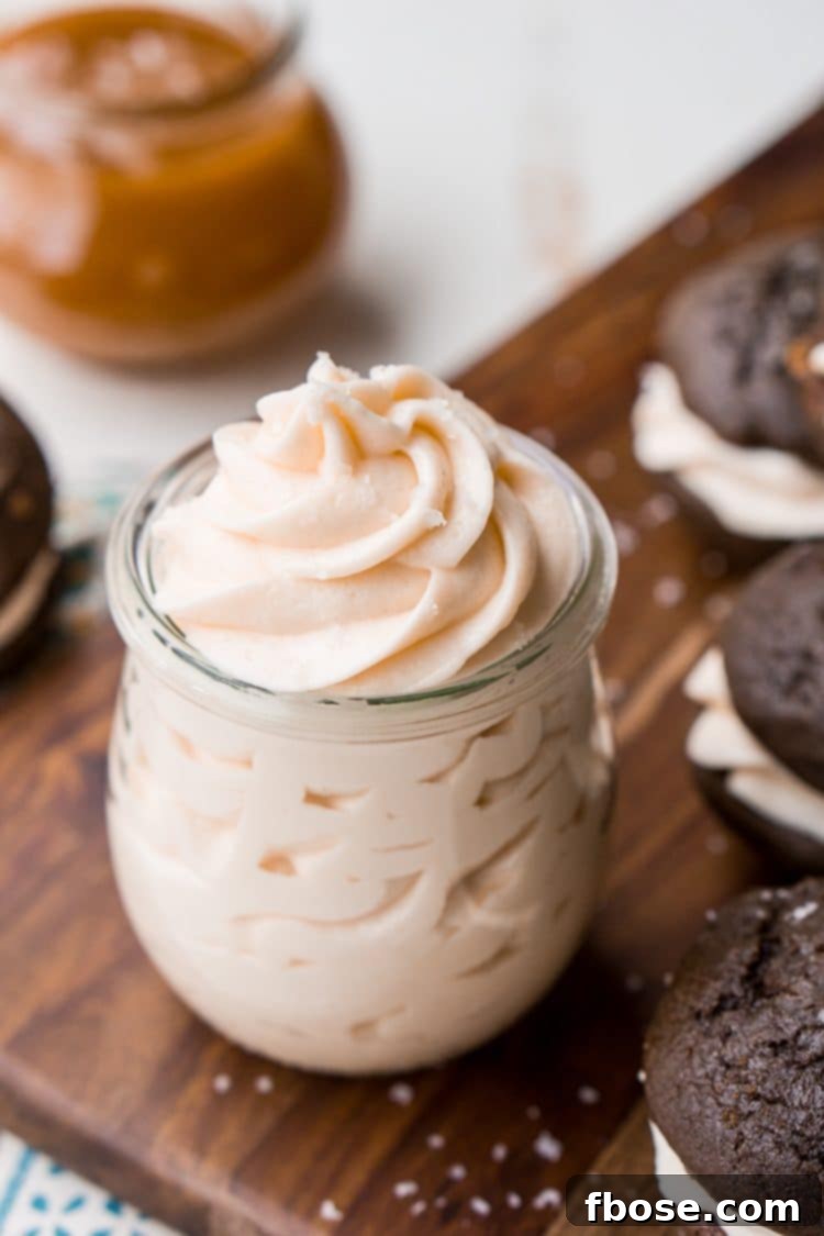 A close-up of smooth, luscious Salted Caramel Frosting, ready to be piped onto your favorite treats.