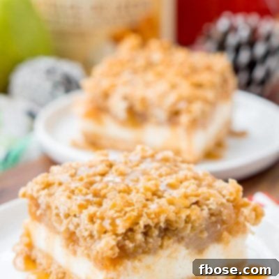 Close up photo of a pear cheesecake bar on a white plate.