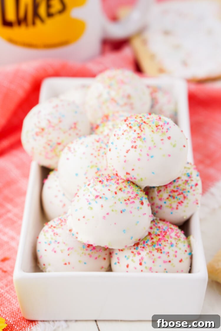 Three handmade Pop Tart Truffles, showcasing the sprinkles and creamy texture.