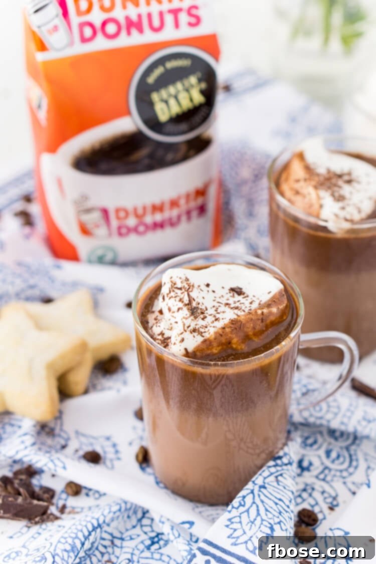 Several mugs of Hot Chocolate Coffee arranged beautifully on a table.