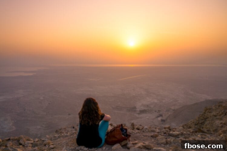 Ancient ruins and structures on Masada mountain, glowing in the early morning sun