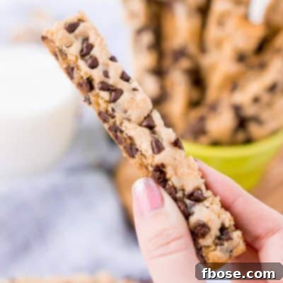 These Chocolate Chip Cookie Sticks are perfect for dunking! A thick, slightly crisp, yet still chewy cookie loaded with mini chocolate chips and made in a 9 x 13-inch pan for easy baking!