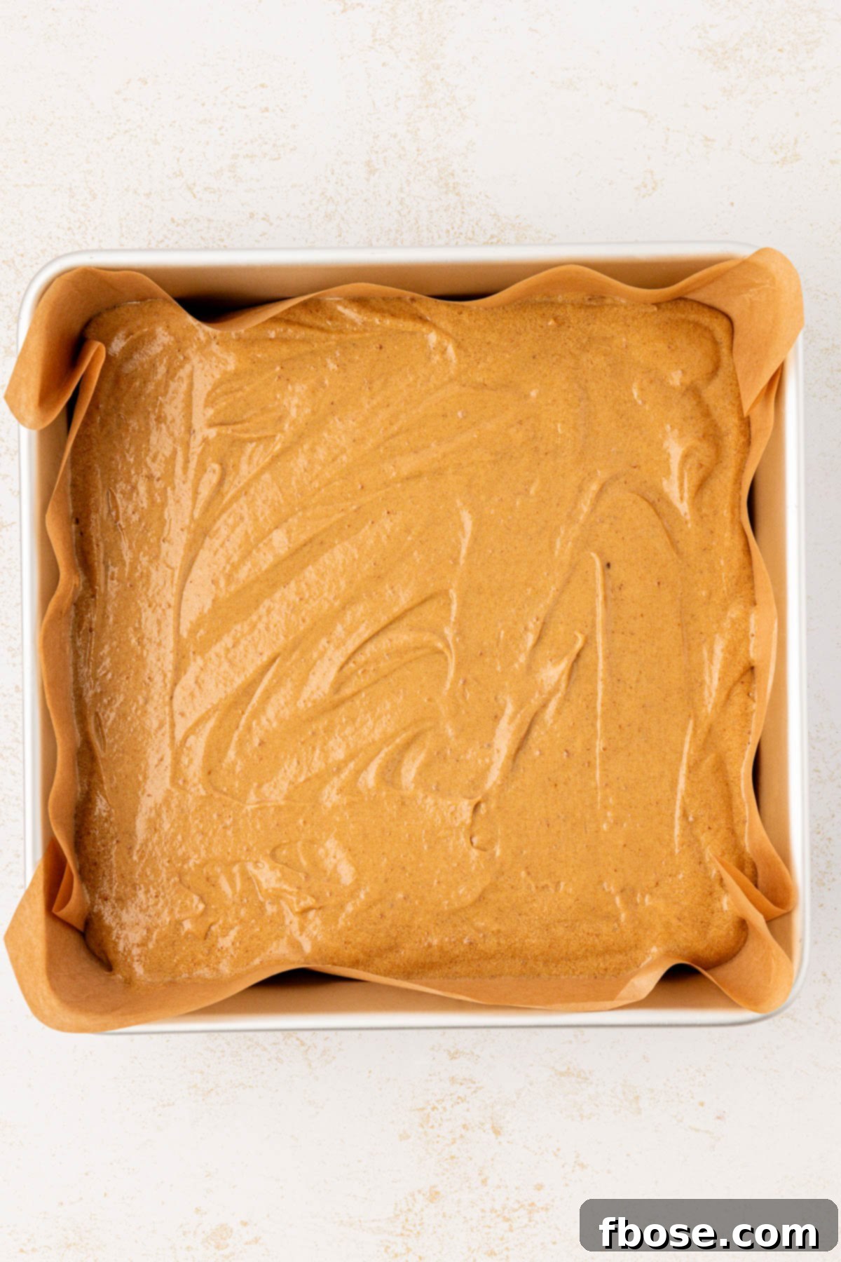 Overhead photo sticky toffee pudding batter in a baking pan.