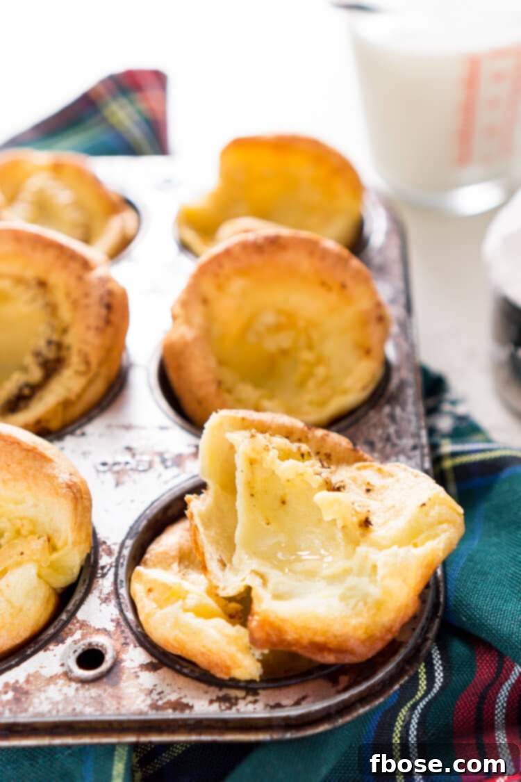 Close-up of a single Yorkshire Pudding with a pool of melted butter