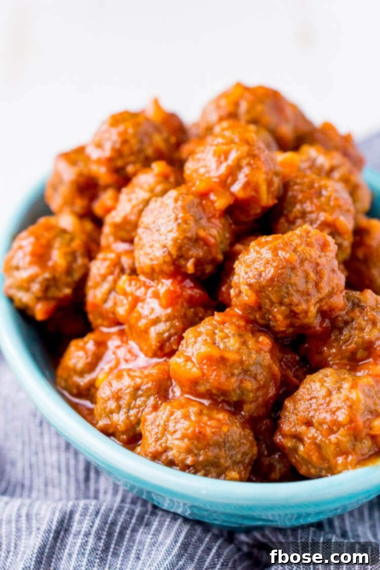 Delicious Pineapple Tequila Meatballs served in a slow cooker, perfect for game day parties.