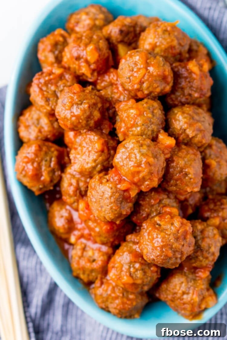 A serving of Pineapple Tequila Meatballs in a bowl, ready to be enjoyed as a party appetizer.