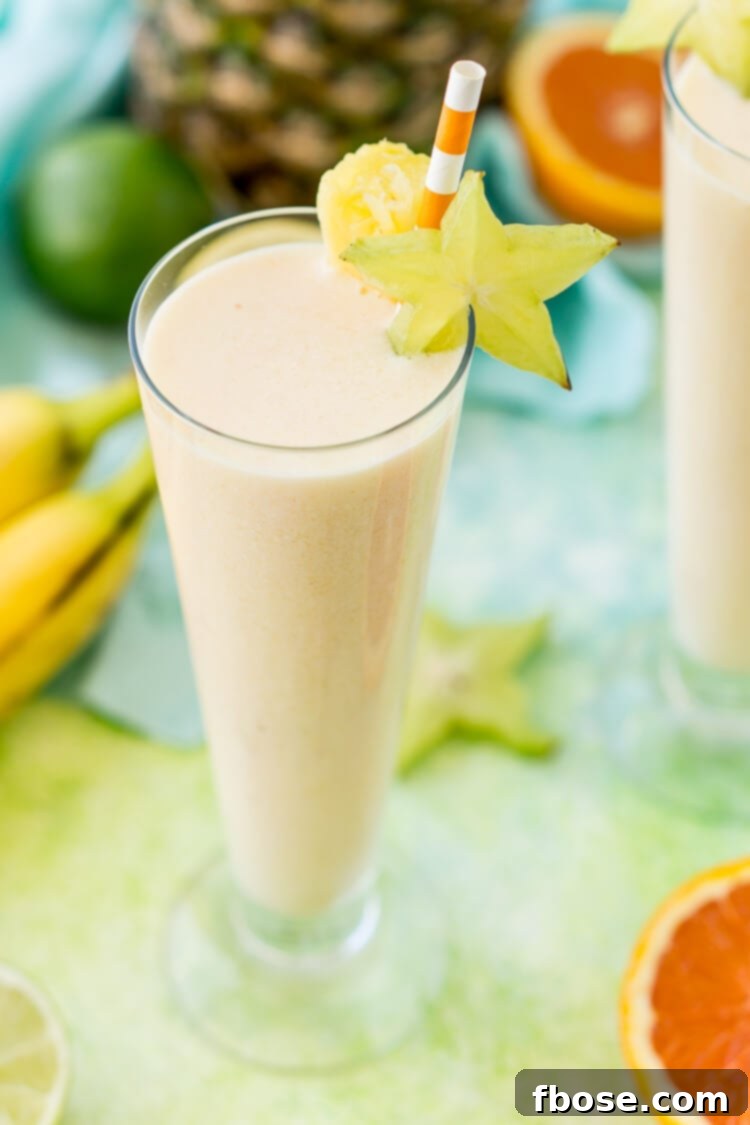 Tropical Smoothie made with orange, bananas, coconut, and pineapple.