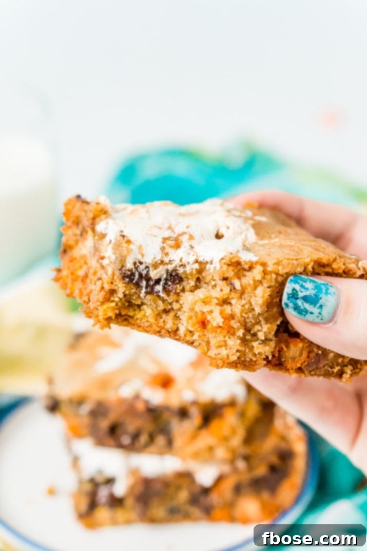 Peanut Butter Cloud Blondies 5 A single serving of Peanut Butter Fluff Blondie, showing its thick, chewy layers and delicious fillings.