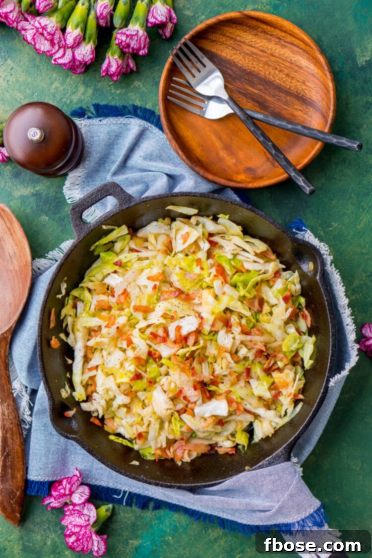 Irish Fried Cabbage and Bacon is a simple recipe that's pan fried in bacon grease and loaded up with bacon pieces and onion and seasoned with brown sugar, salt, and pepper.