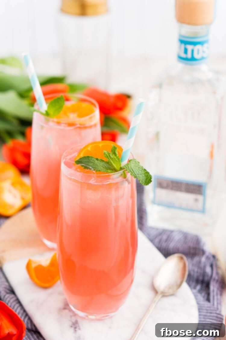Cactus Cooler Tequila Cocktail being poured into a glass, highlighting its vibrant color.