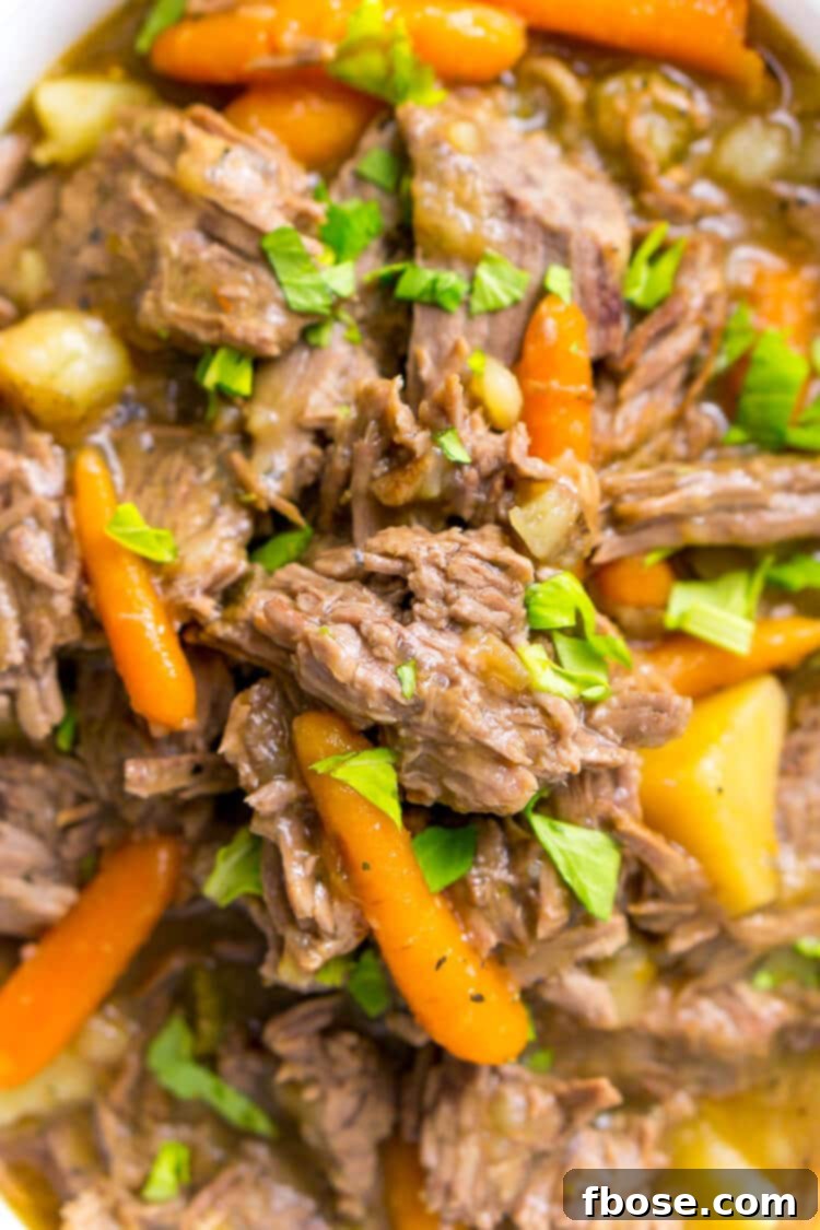 Close-up of perfectly tender Instant Pot Pot Roast, nearly falling apart, ready to serve.
