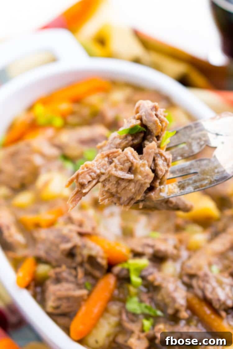 Platter of Instant Pot Pot Roast, shredded beef, and tender root vegetables.