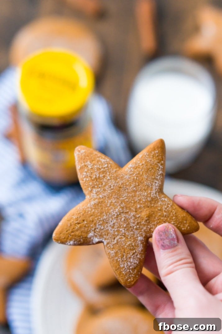 Classic Chewy Molasses Cookies 4 A plate of freshly baked molasses cookies, perfectly soft and round, ready to be enjoyed. Highlighted as a simple yet classic recipe.