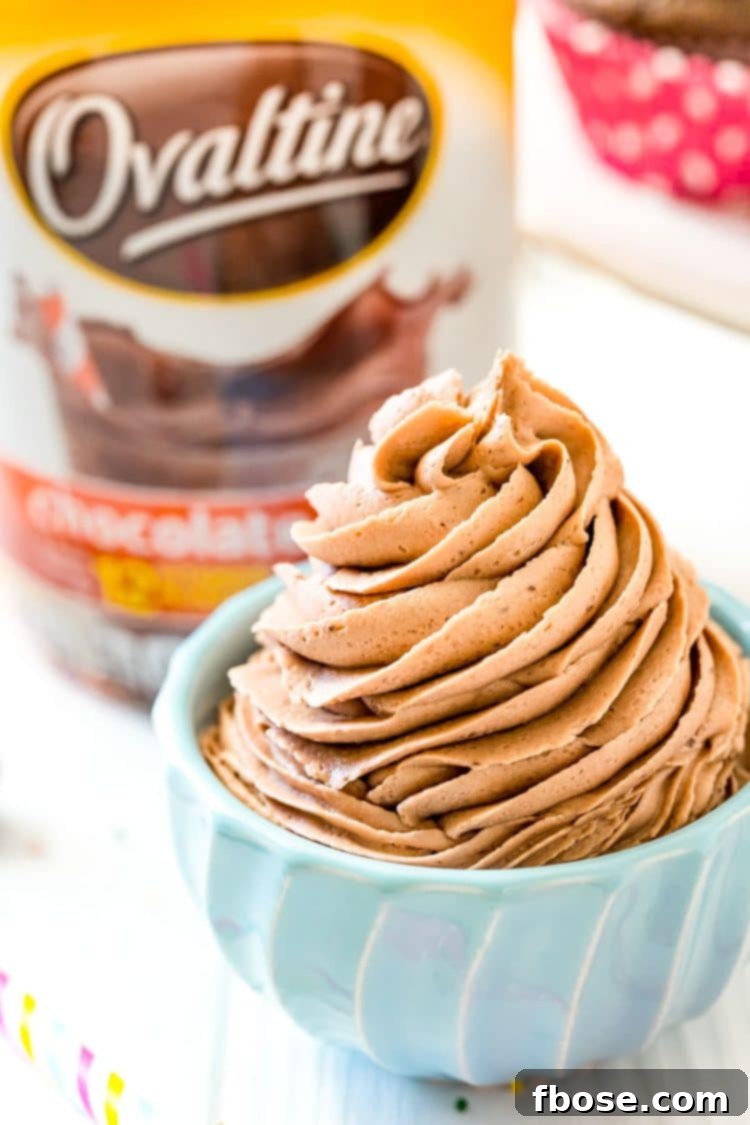 Ovaltine frosting piped into a small blue bowl.